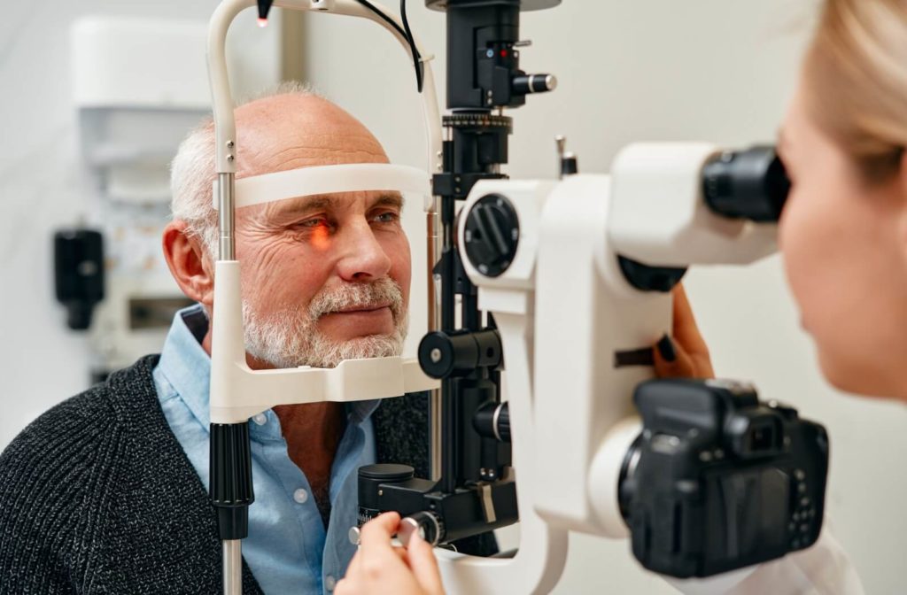 A patient has their eye examined with a slit lamp during a diabetic eye exam.