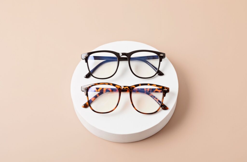 A pair of glasses resting on a white dish